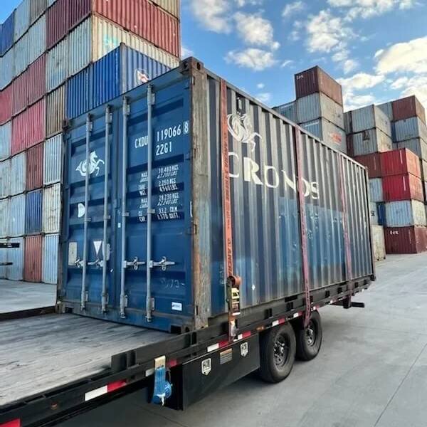 Shipping container delivery in progress